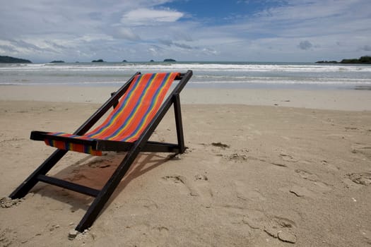 Sun lounger on the sandy beach
