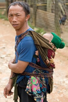 Father with baby in Laos