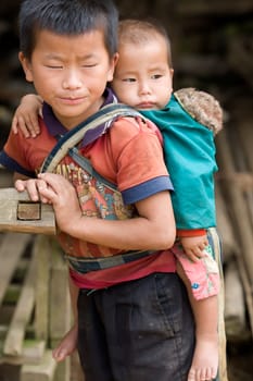 Laotian boy with baby