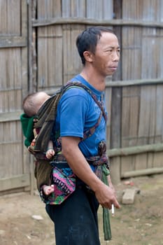 Father with baby in Laos