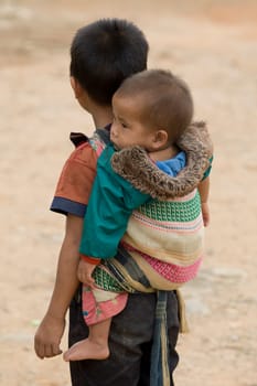 Laotian boy with baby