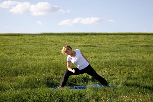 Woman doing yoga - preparation for the big triangle