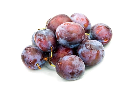 Fresh plums with drops of water