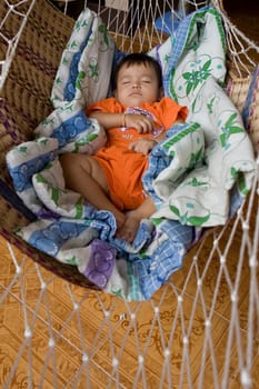 Baby sleeps in hammock