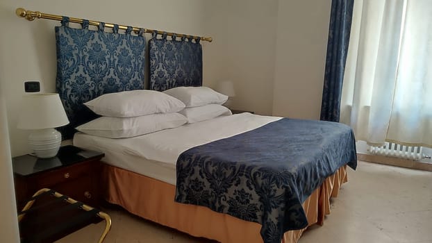 Cozy elegant bedroom furniture room interior design decor decorations objects house hotel apartment windows bed blue white lamp . High quality photo