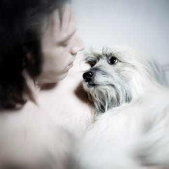 young man and labrit dog