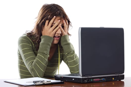 Beautiful frightened girl with laptop