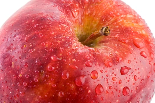 Macro apple with red drops of water