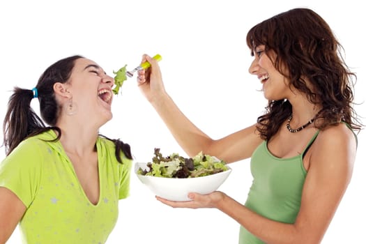 Two beautiful girls with a salad