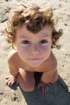 Funny photo of the child on the beach