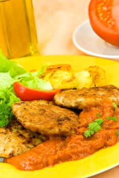 Meatballs with fried potatoes,tomato sauce
