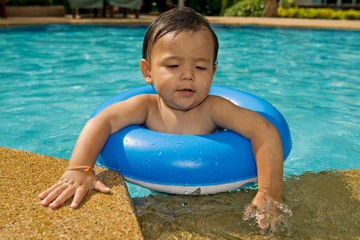 Baby with swimming ring