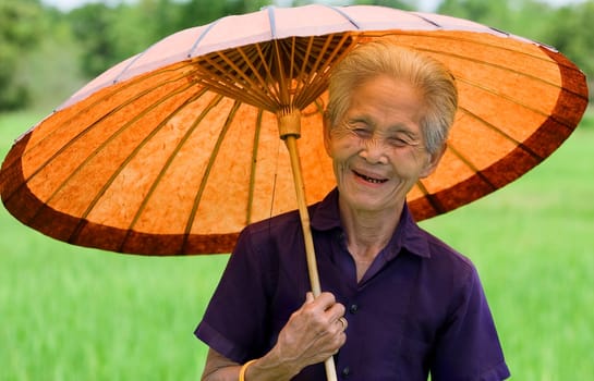 old asian woman with parasol