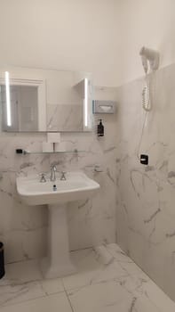 Elegant marble bathroom interior design decor decorations objects architecture ceramic wall white beige indoor house hotel apartment . High quality photo