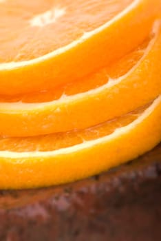 Sliced oranges on brick