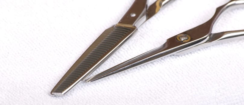 Hairdressing scissors on towel