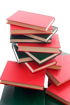 Many books stacked on a white background