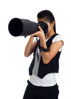 Young asian woman with camera and telephoto