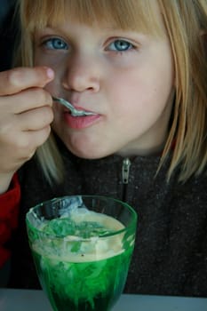 Little girl eats jello