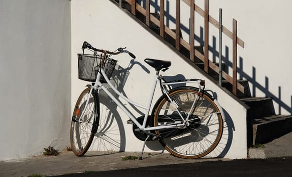 white bicycle on white wall
