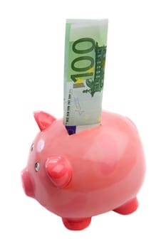 Note of one hundred of euros in a piggy bank