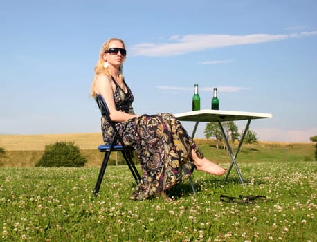 Picnic with beautiful woman on meadow