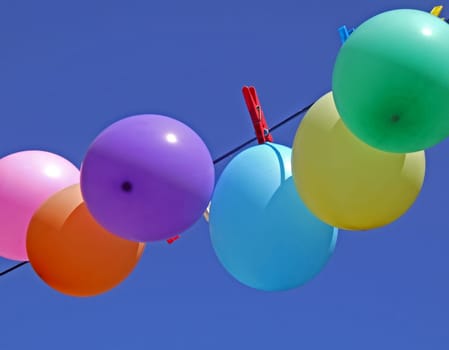 Balloons on a clothesline