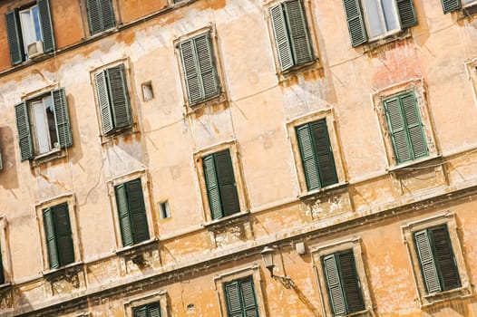 Diagonal framing with detail of a typical facade of an old Roman house with windows