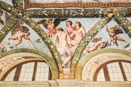 Rome, Italy, August 27, 2008: Cupid and the three Graces. Fresh paintings by famous artist Raphael. Villa Farnesina. Loggia of Cupid and Psyche
