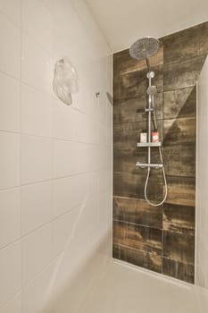 a shower room with wood wall and white tile flooring on the walls, along with an overhead shower head