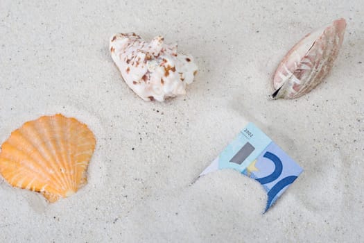 Money in the sand
