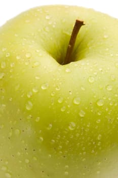 Macro of green delicious apple with refl