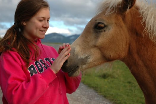 Teenager with Hafllinger foal