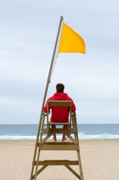 Lifeguard sitting in his chair