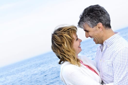 Mature romantic couple at seashore