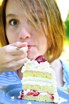 Girl eating a cake