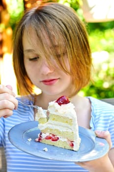 Girl eating a cake