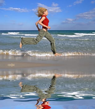 Woman running by the sea