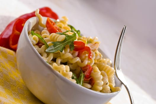 Pasta salad with chicken breast,rocket and tomatoes