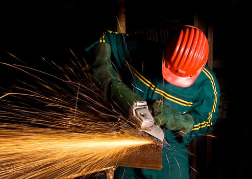 manual worker with grinder