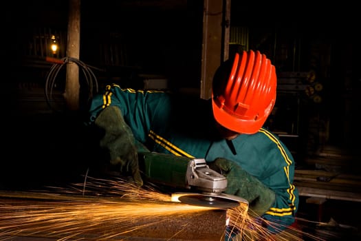 heavy industry worker with grinder