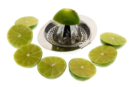 Limes with lemon squeezer