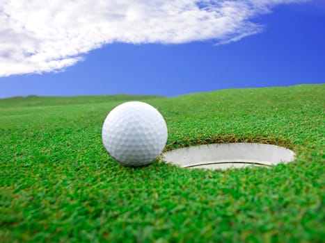 Golf - detail ball with hole on green