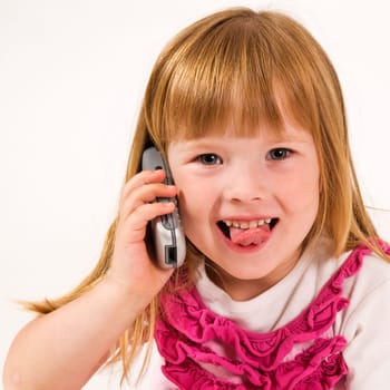 girl with phone showing tongue