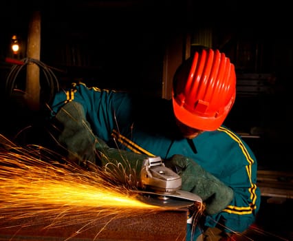 heavy industry manual worker with grinder 01