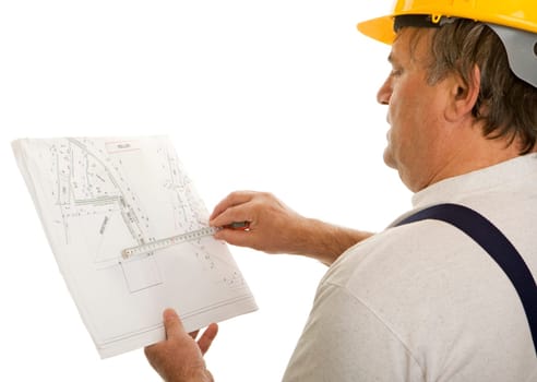 Construction worker with an architect's plan