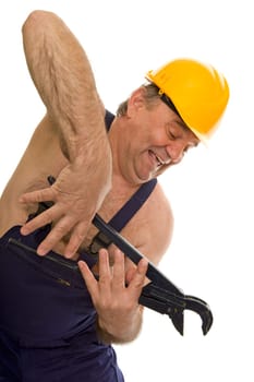Plumber with pipe wrench and safety helmet
