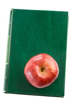 Apple red on a green book