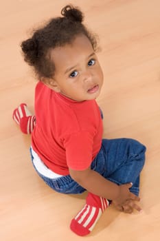 Adorable african baby kneel down