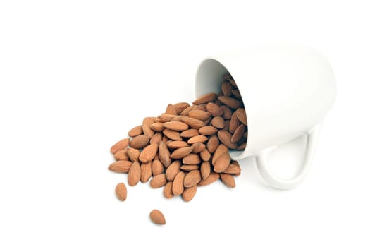 almonds spilt from cup